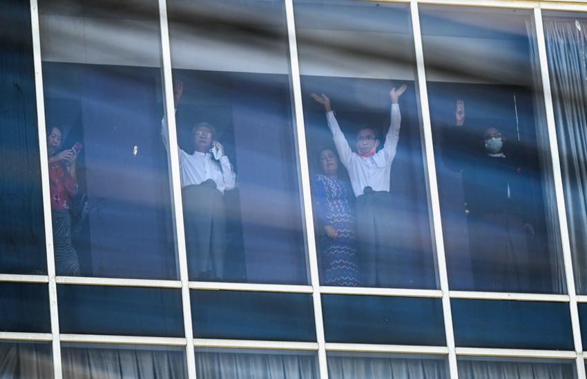 Elected MPS wave to protesters