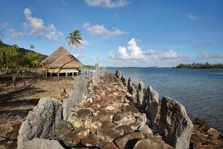 Marae Rauhuru, a stone courtyard with platform and standing stones, built by a Polynesian civilisation