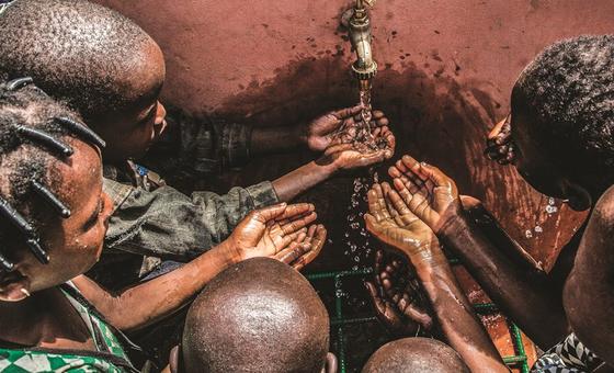 Children at a tap