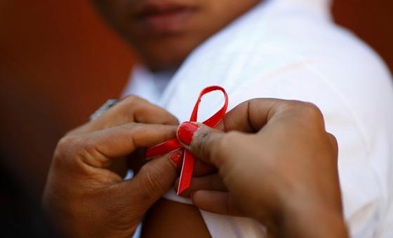 Child with the AIDS ribbon
