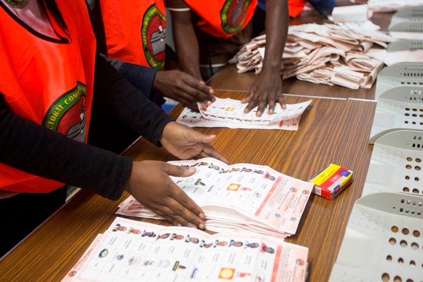 Election officials count ballot papers at a voting station in Lusaka, January 20, 2015